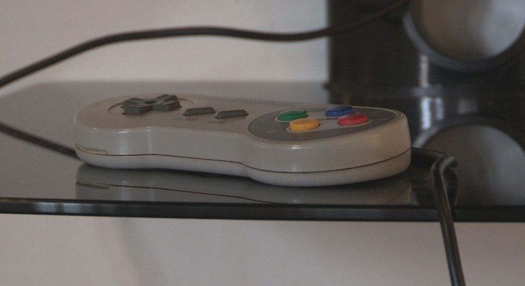 Image: A controller for the 90s SNES system